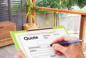 picture of clipboard offering free wrought iron estimate no obligation quote as estimator observes deck and railing