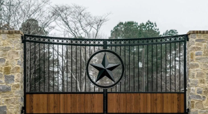 texas style custom iron driveway gate with a large black star in the center giving a texas flare